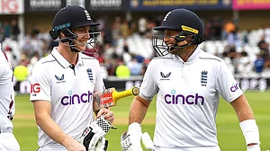 Photo: AP/Rui Vieira : England's Joe Root and Harry Brook.